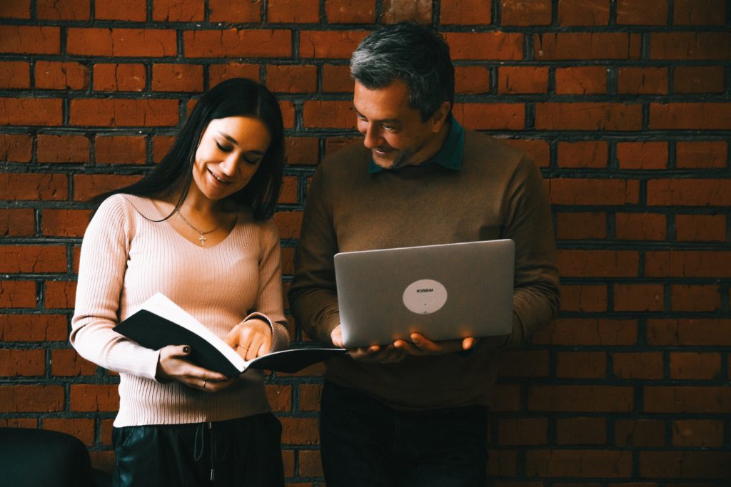 man and woman looking at notes 3746943