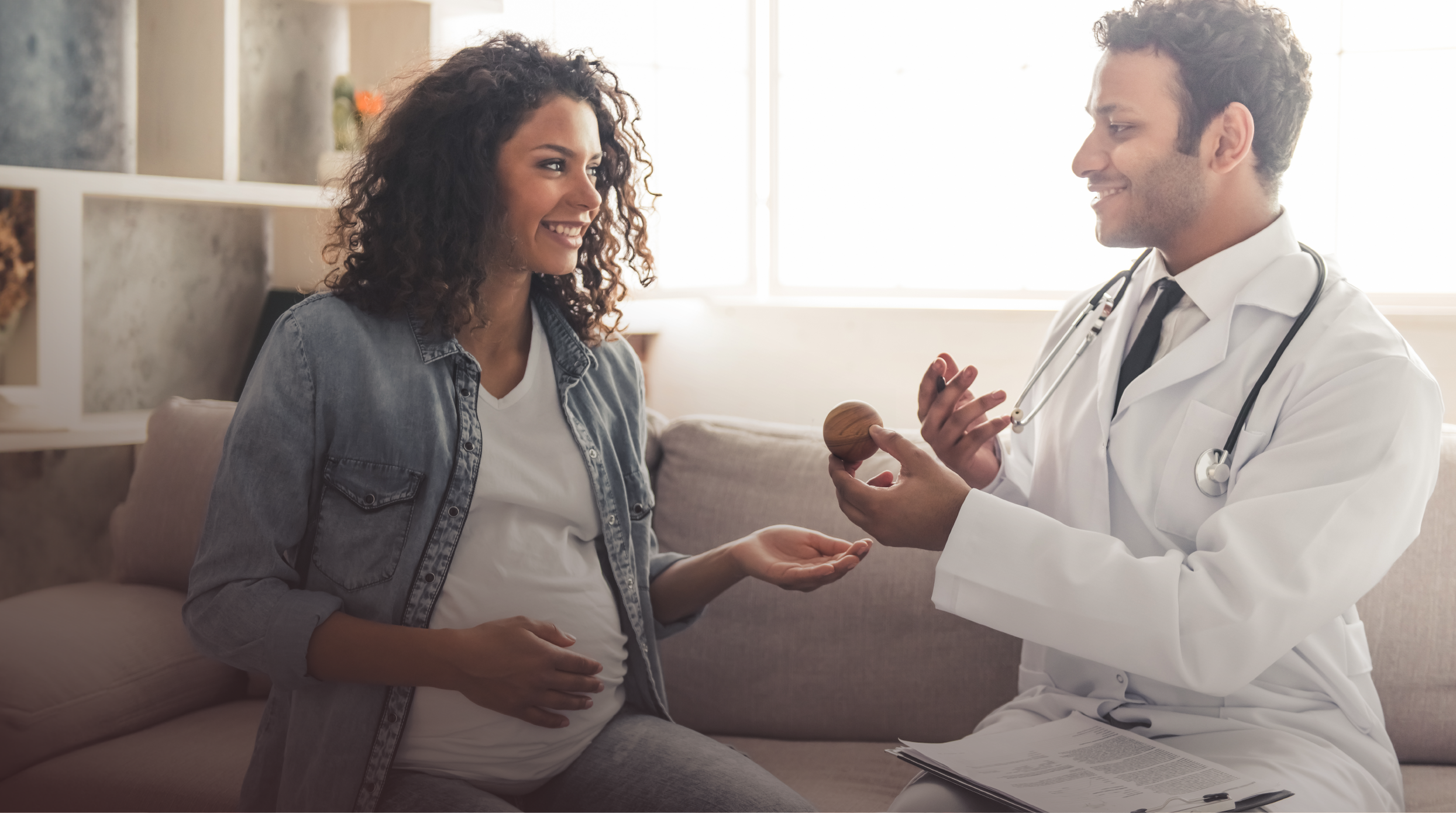 Consultant speaking with a pregnant woman