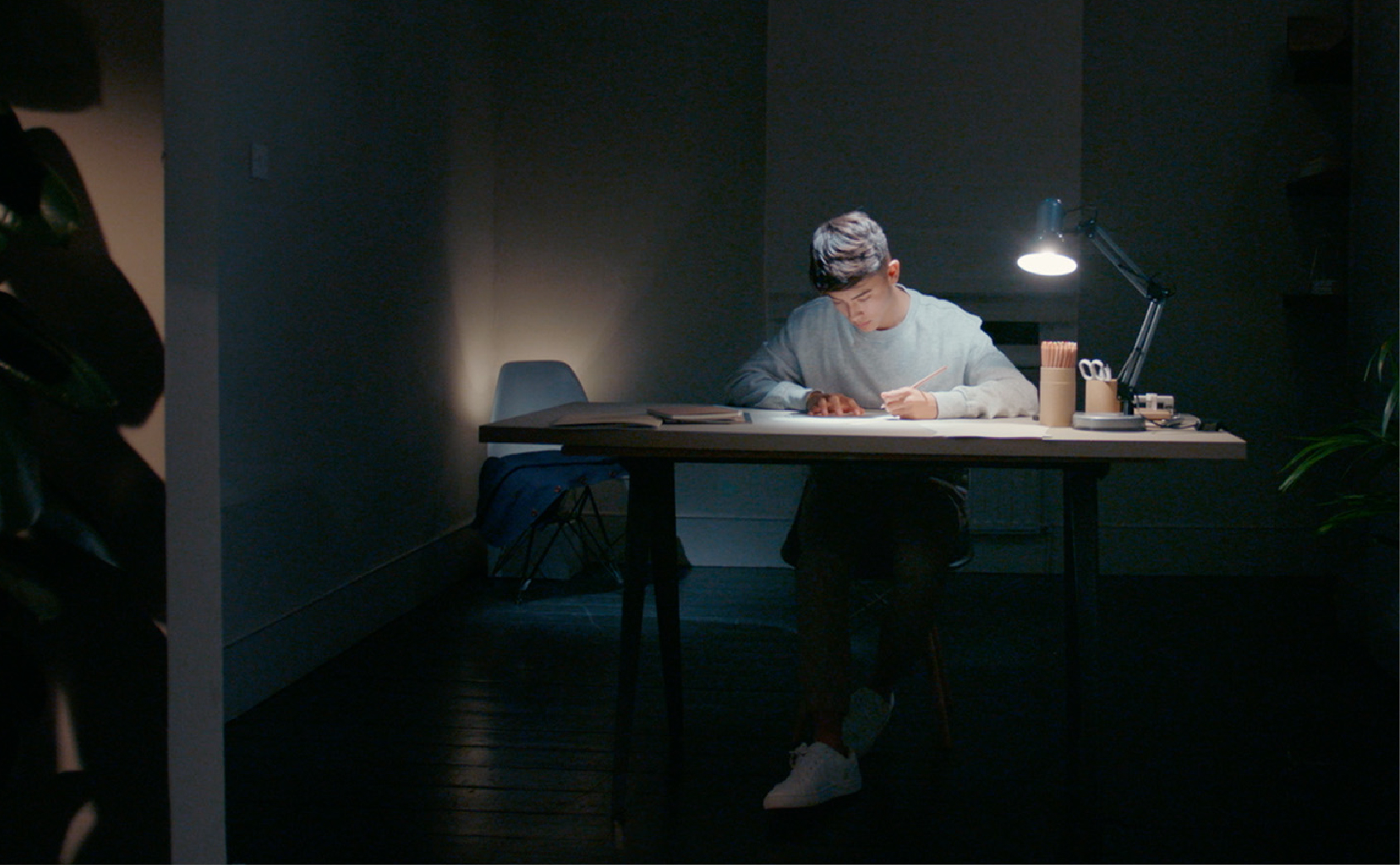 Man at desk with OcuMax lighting