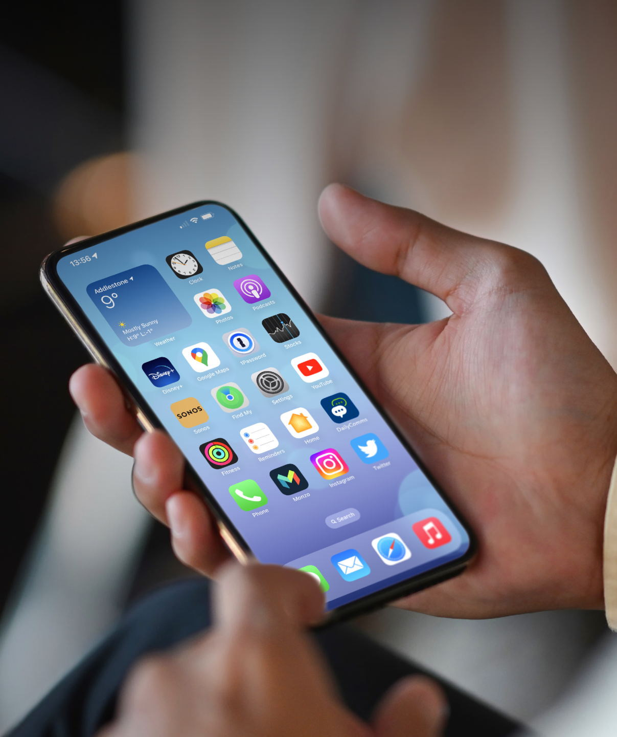 Someone holding iPhone in hand with Philips app on the homescreen