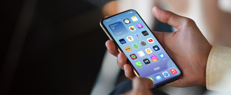 Someone holding iPhone in hand with Philips app on the homescreen